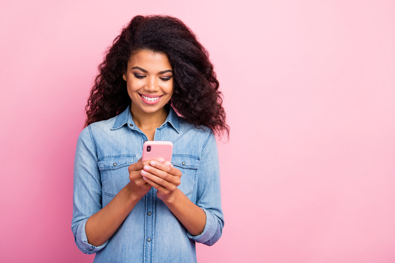 A Teenage Girl Using Social Media Intentionally On Her Phone
