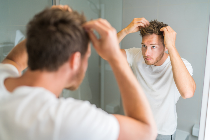 Young Man Completing His 5 Minute Morning Grooming Routine