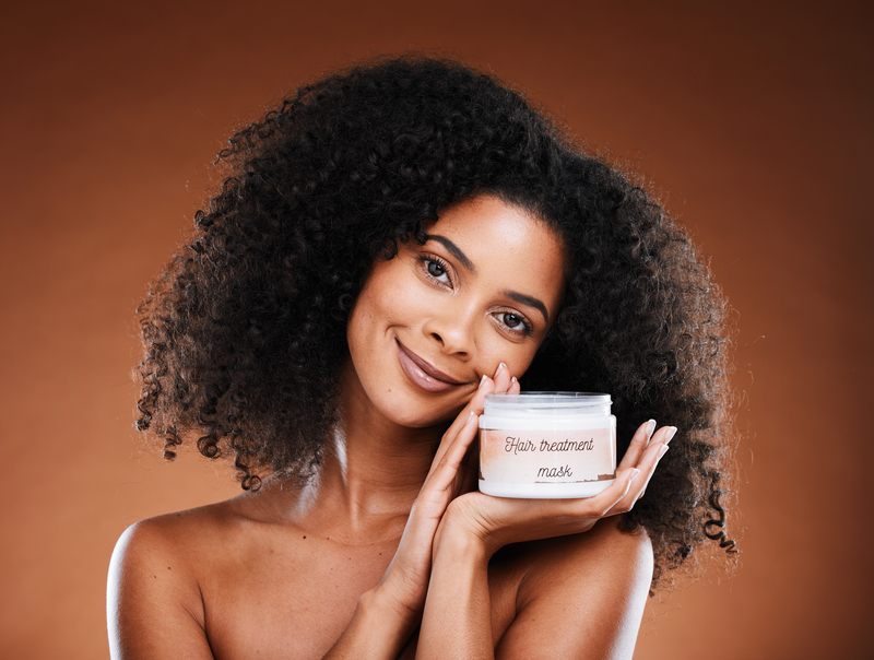 Young Woman Holding A Hair Product That May Not Work For Everyone