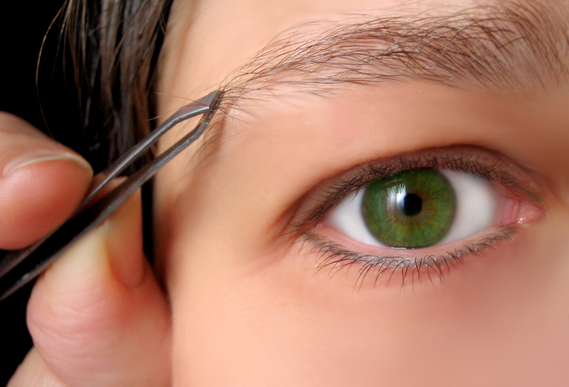 Young Person Checking Eyebrows As Part Of Small Grooming Habit Routine